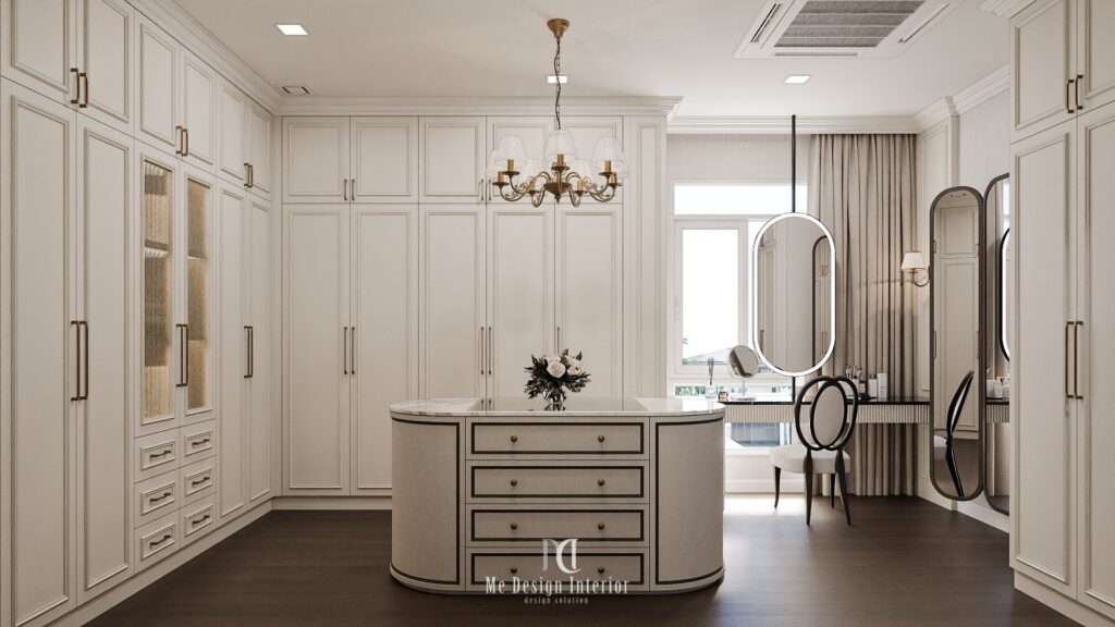 luxury walk-in closet with white built-in cabinets, central island storage, marble top, and classic panel design